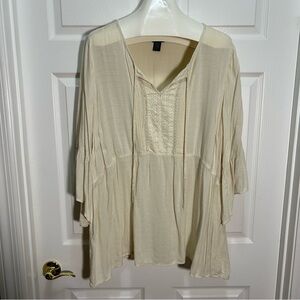 Torrid Cream Tunic Top with Elegant Design
